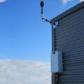 Norsonic Nor1545 environmental cabinet and Nor1216 outdoor microphone mounted on wall